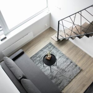 Aerial view of a stylish minimalist loft with modern furnishings and elegant decor.