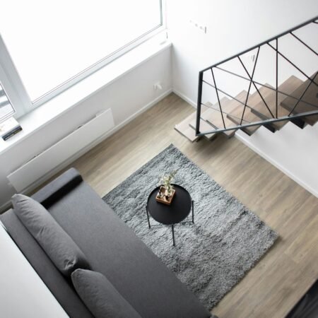 Aerial view of a stylish minimalist loft with modern furnishings and elegant decor.
